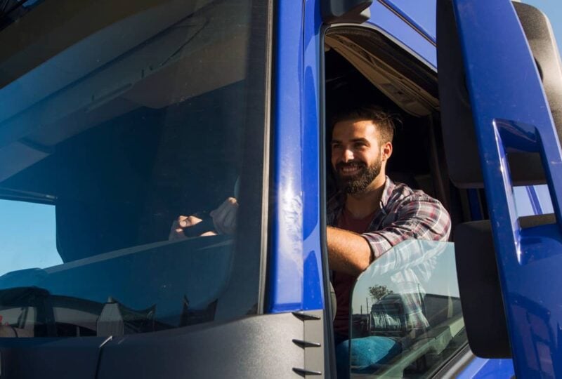 Driver in a modern connected truck cab