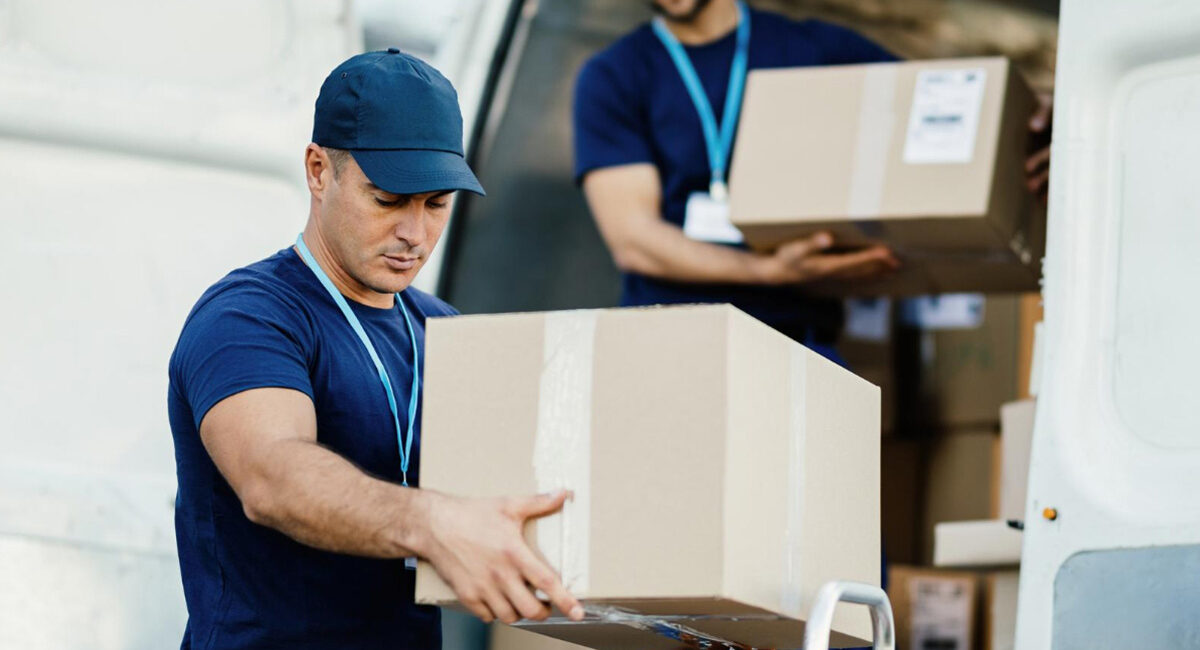 Team loading cartons into a delivery vehicle