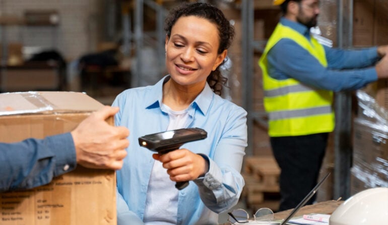 Operator scanning inventory in a distribution centre