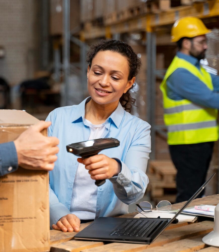 Warehouse operator scanning a high-value technology shipment
