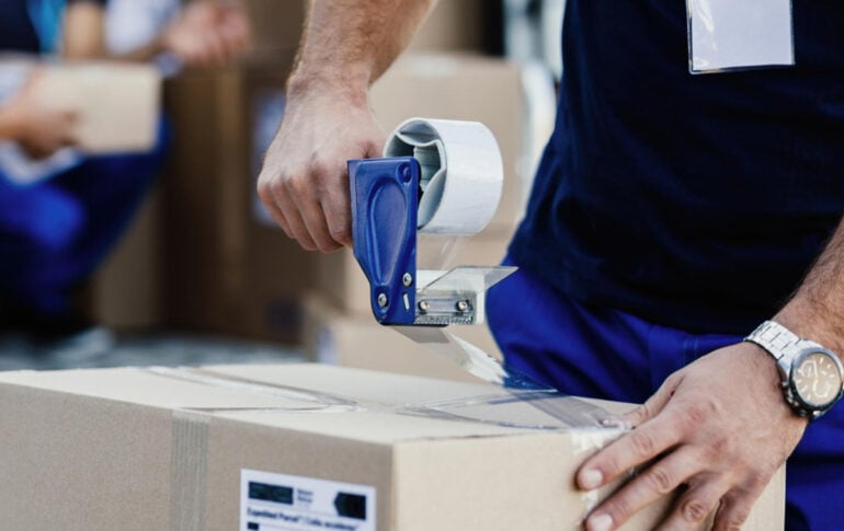 Parcel being sealed for e-commerce fulfilment