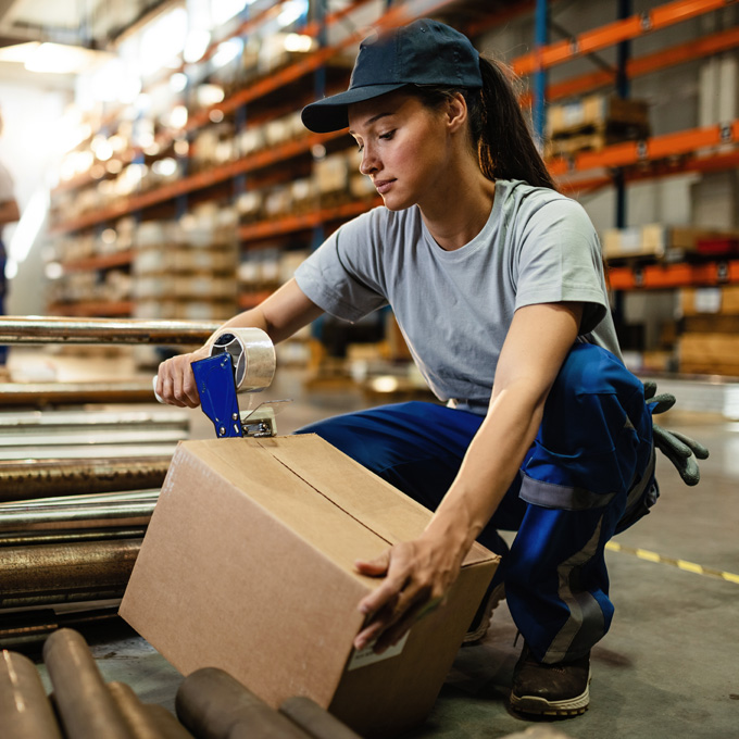 Operator packing manufactured components in a distribution centre